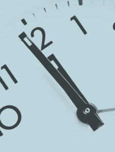 Close up on clock, symbolizing time management